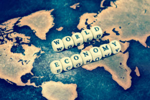 WORLD ECONOMY on grunge world map